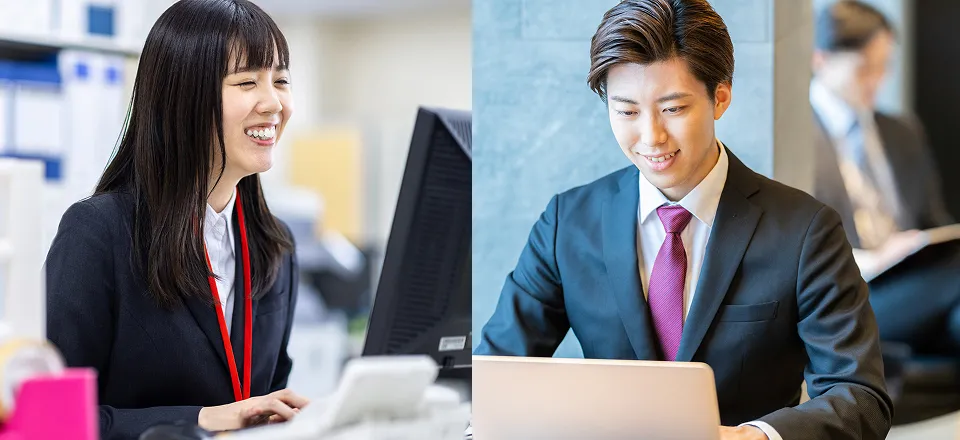 笑顔でオフィスワークに励む若い男女社員